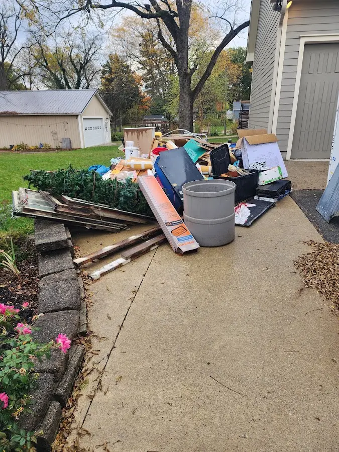 Dumpster being loaded with debris for Roofing Dumpster Rental in Fallon